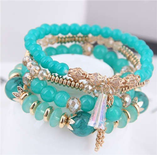 Turquoise green bead and a crystal tassel